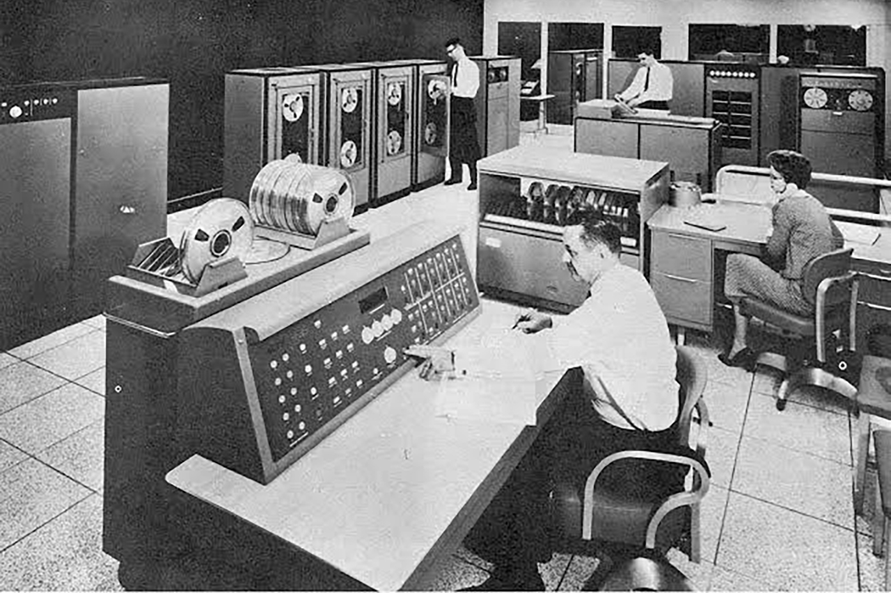 NCR computer room with reel-to-reel data systems and computer equipment in the 1960s